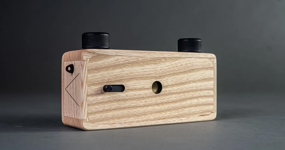 Pinhole camera held up to camera, soft dreamy image result shown