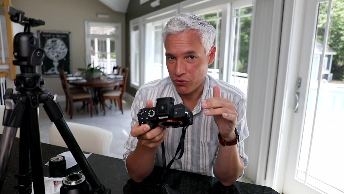 Sensor cleaning swab being used inside camera body
