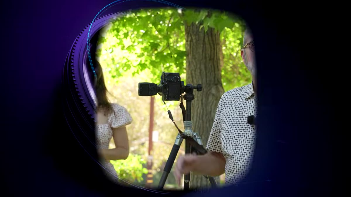 Host explaining the natural light outdoor portrait setup