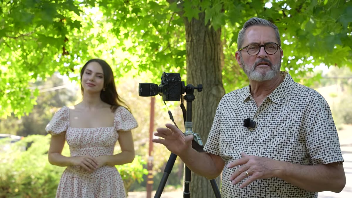 Outdoor portrait with tree bokeh and natural light on subject