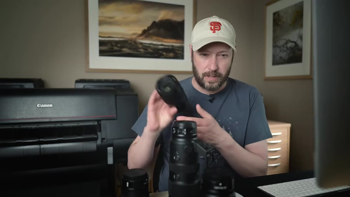 Danson holding up the 24-70mm f/2.8 and 70-200mm f/2.8 side by side