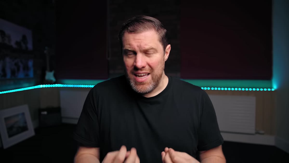 caption: Presenter outlining the gear purchase triangle concept