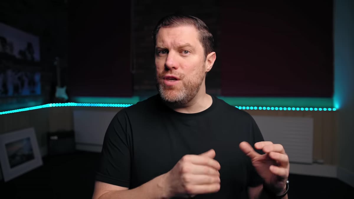 caption: Presenter discussing camera recommendations by price bracket
