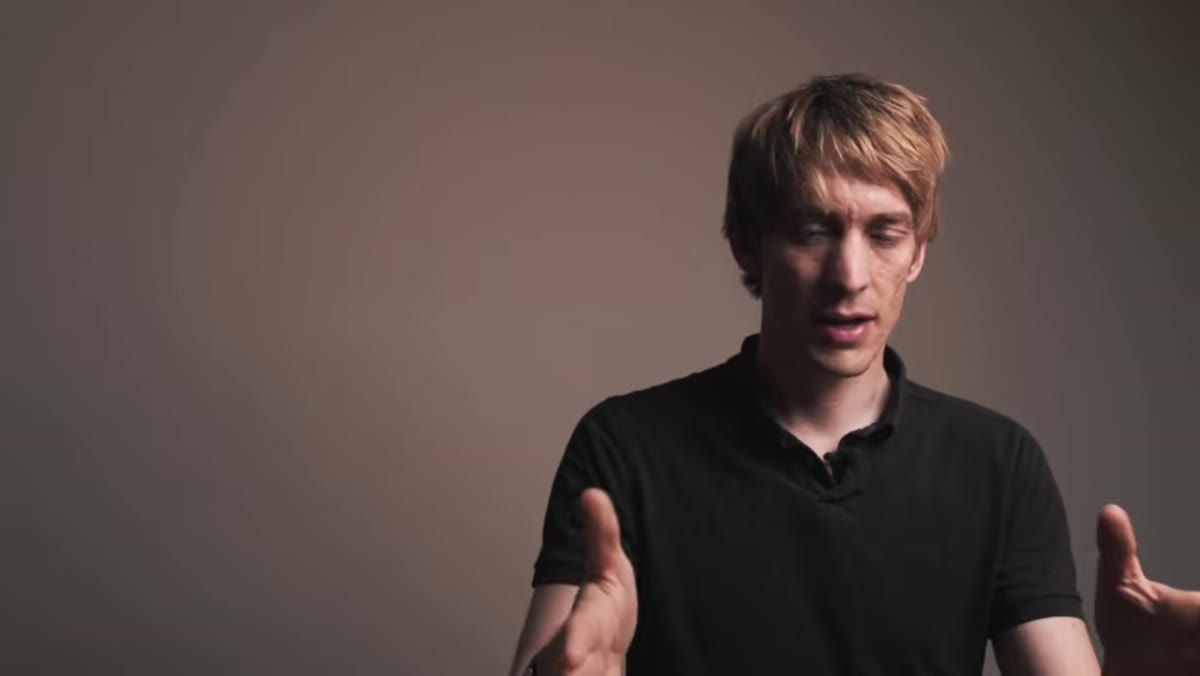 Tucker describing pro photographer positioning tripod near window light