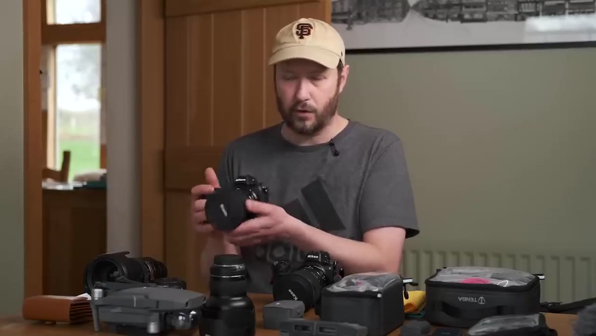 Nikon Z6 with wide-angle lens mounted, being placed into bag