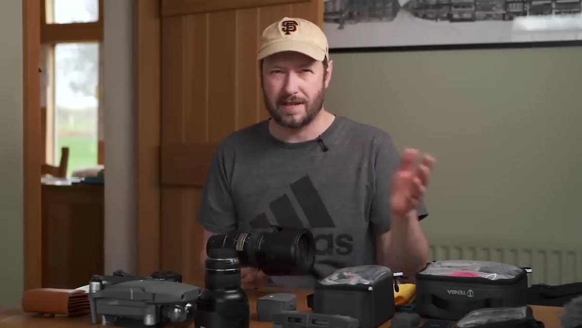 Three lenses arranged next to camera bodies on a flat surface