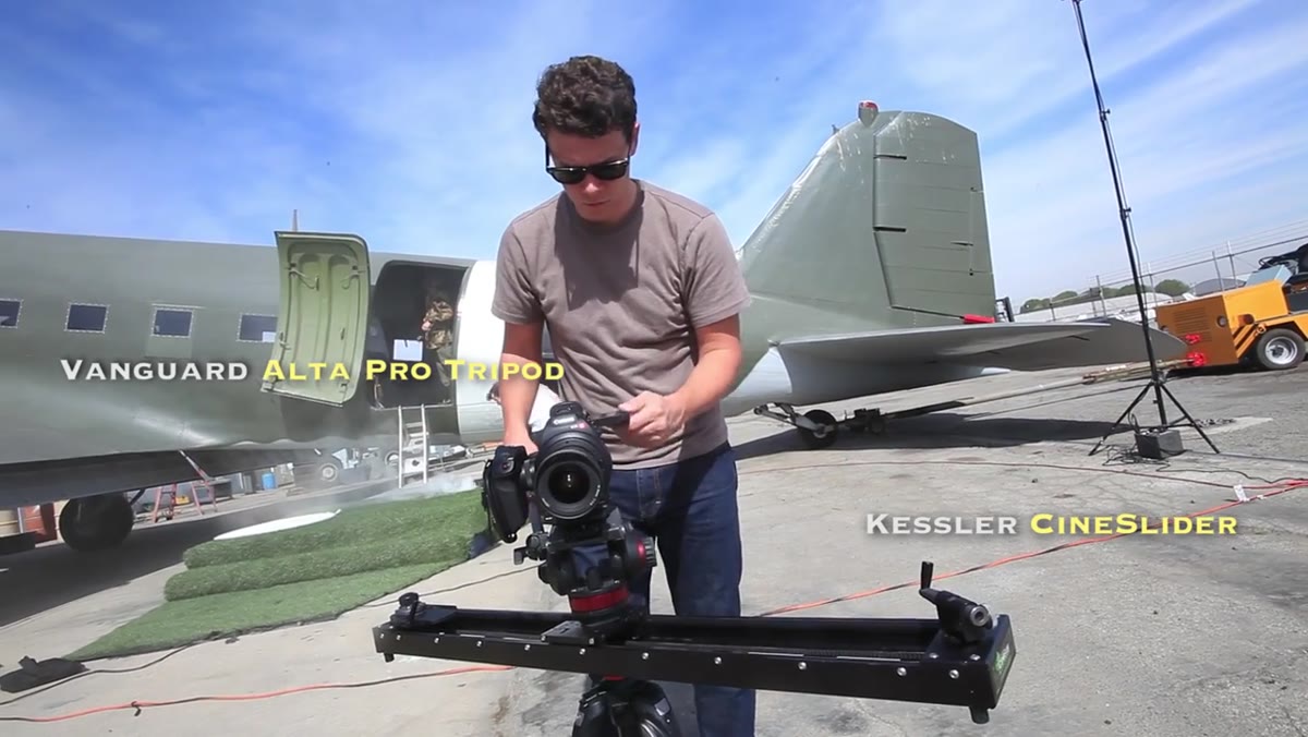 Host holding 45mm tilt-shift lens, explaining focal length