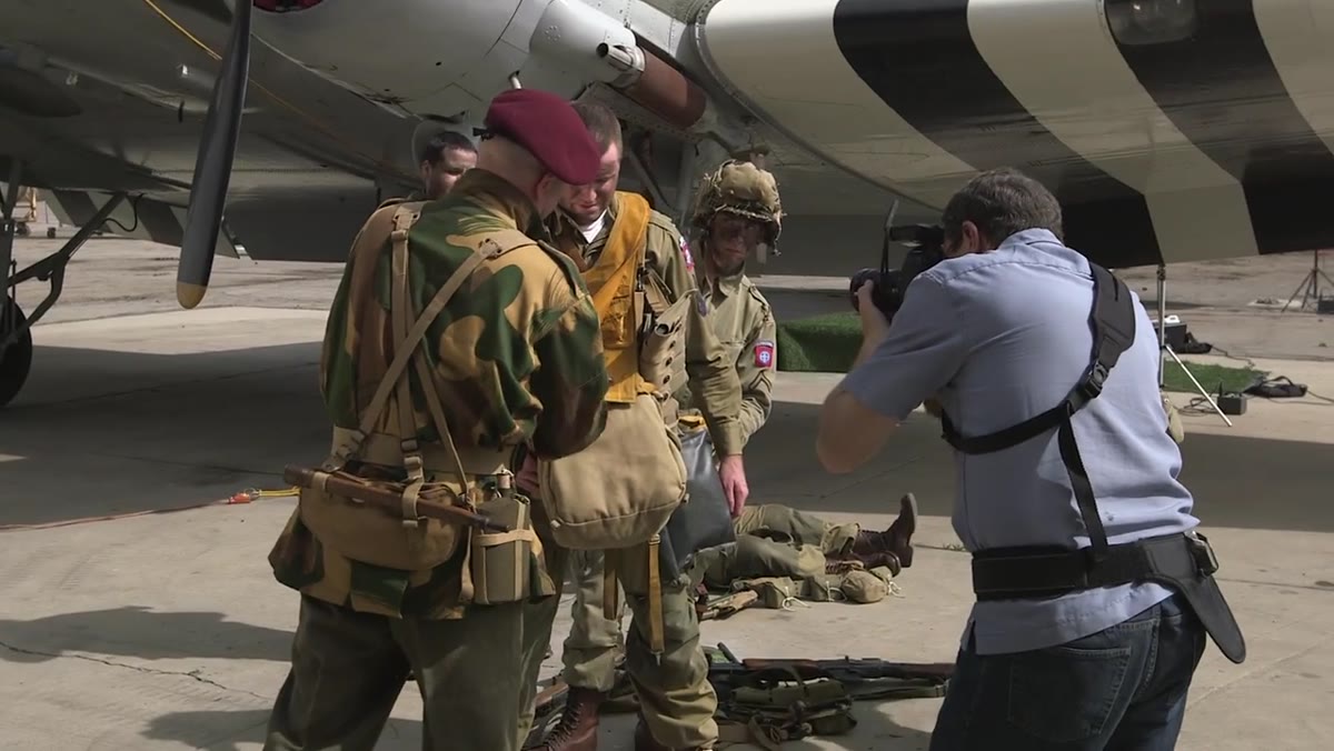 Photographer refocusing on subject after tilting lens