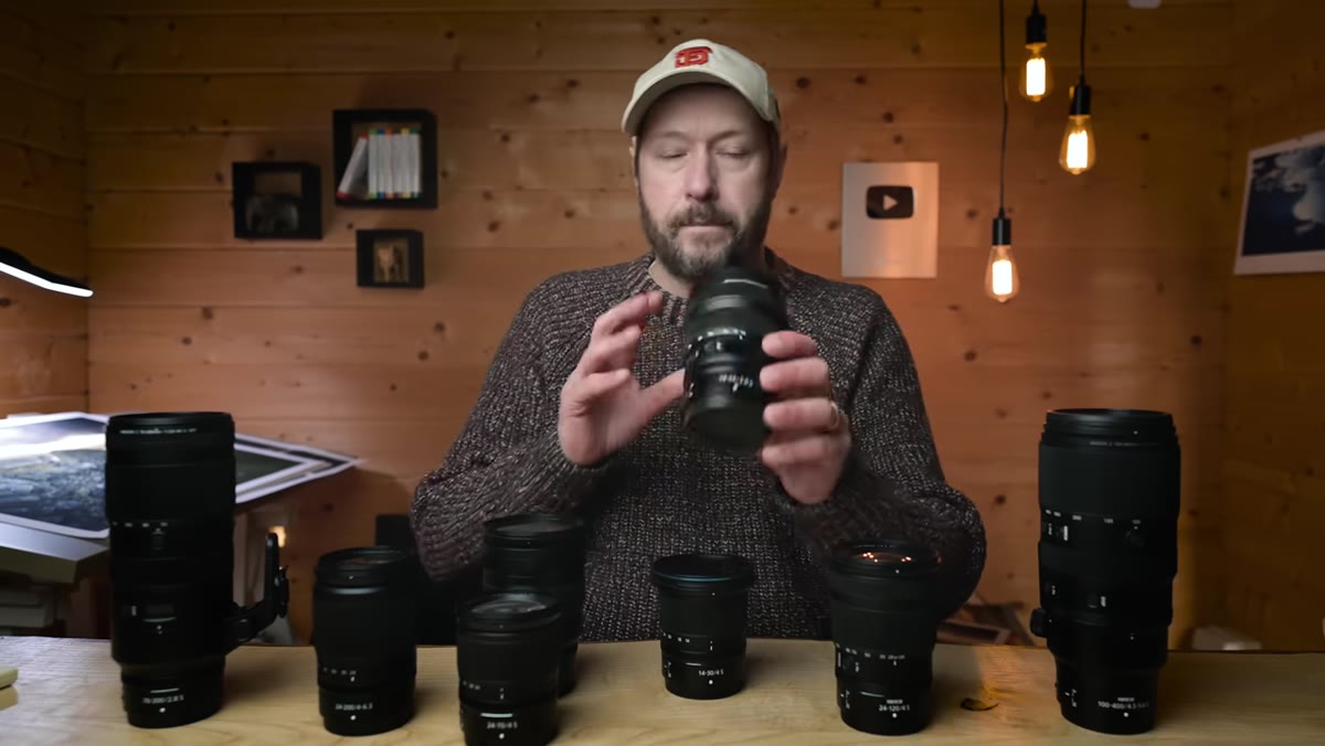 Side-by-side of 14-24mm and 14-30mm lenses in hand