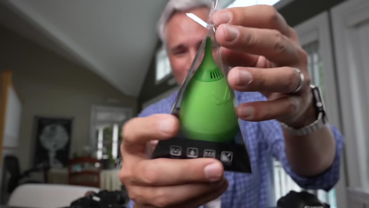 Lens pen being used in circular motion on front element