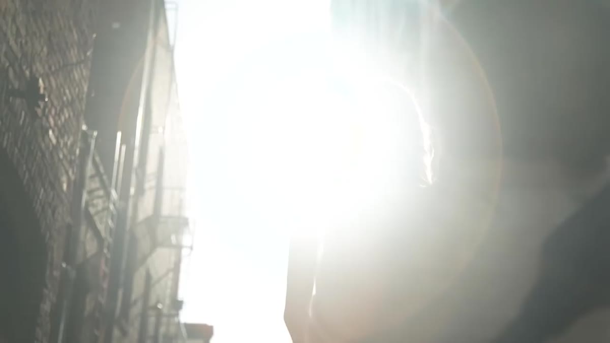 Sun partially hidden behind building edge during outdoor shoot