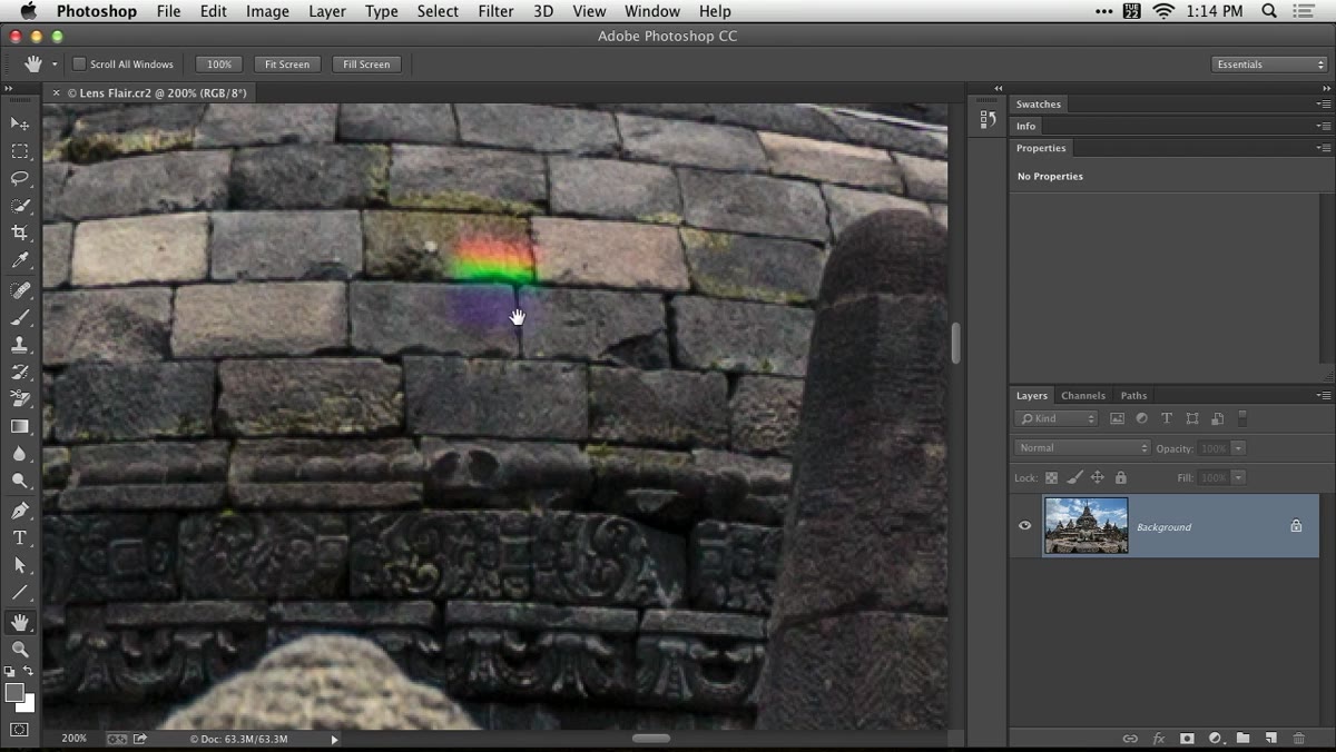 Colorful lens flare visible over architectural subject