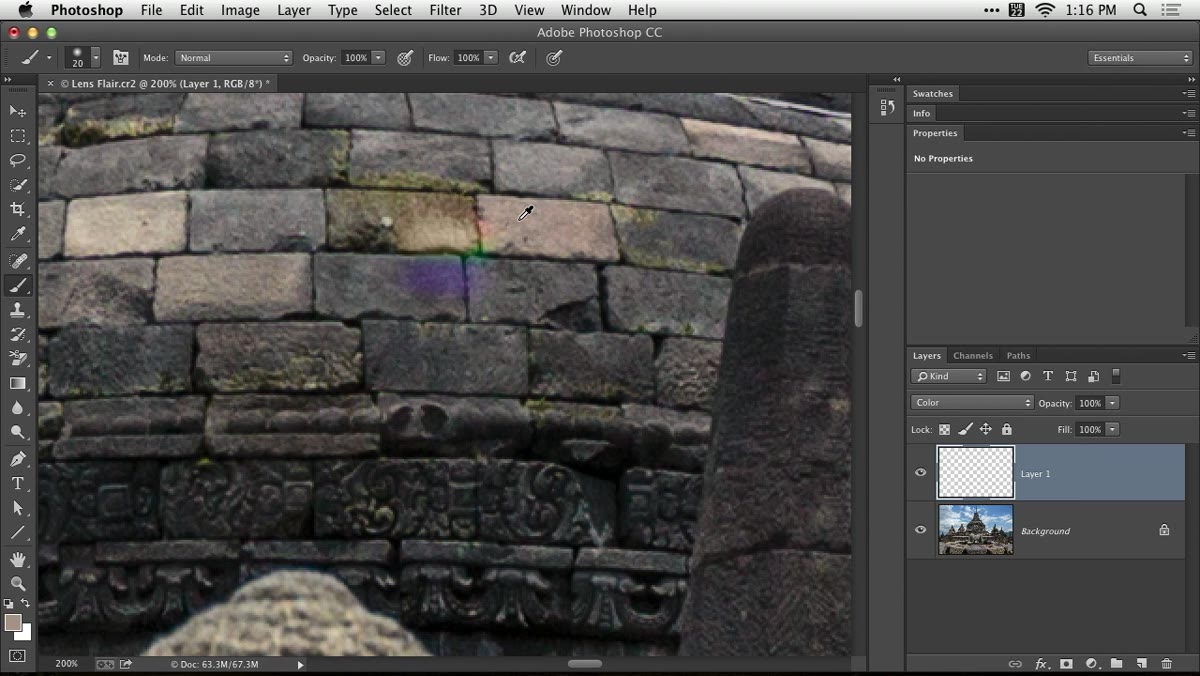 Painting over lens flare with color sampled from surrounding area