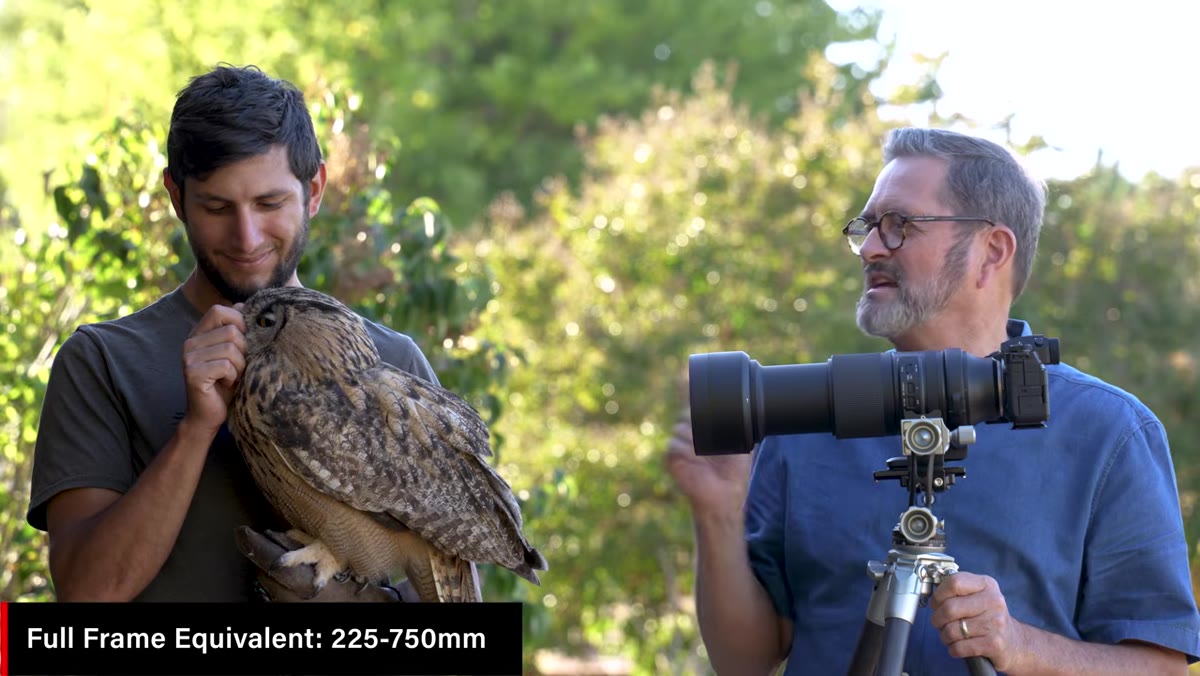 Presenter close to owl, demonstrating near-focus capability