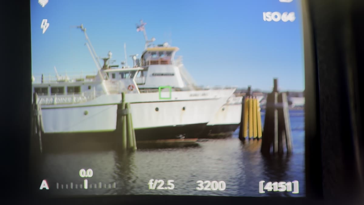Tony zooming into a boat photo showing extreme detail in the X2D file