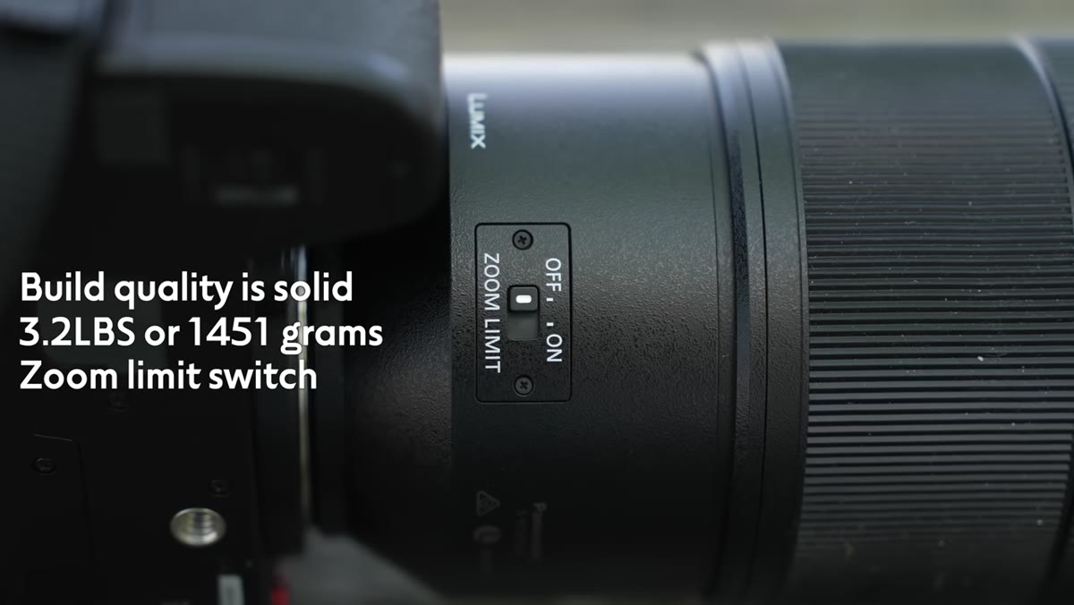 Close-up of the zoom limiter and focus limiter switches on the lens barrel