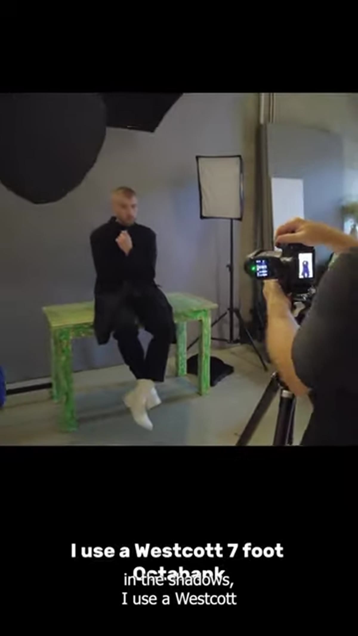 Large octobox positioned behind photographer for fill