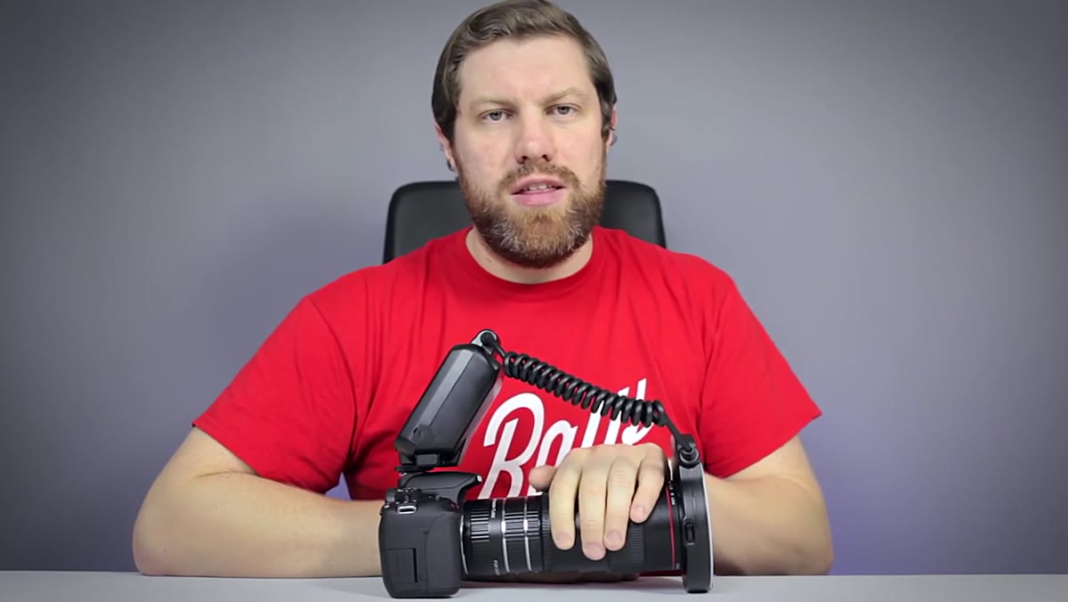 Canon 100mm f/2.8L macro lens shown on camera body