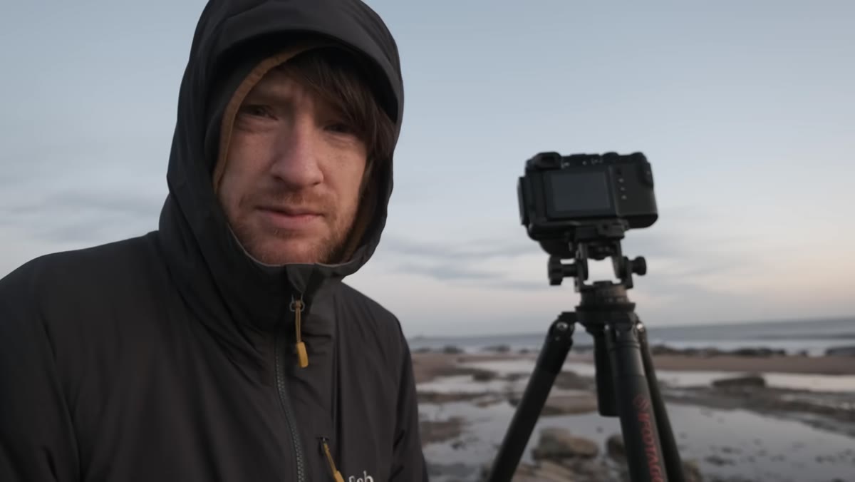 Heaton selecting f/16 aperture setting on GFX 50R in the field