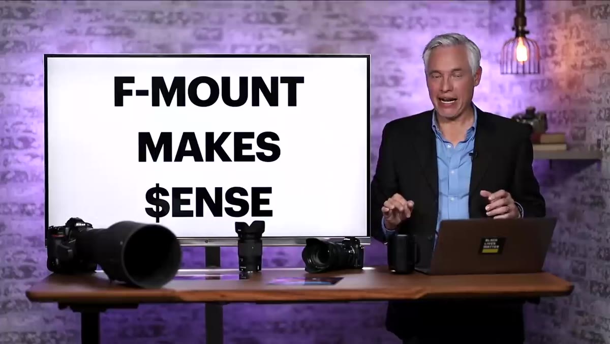 Tony referencing camera sales data on screen