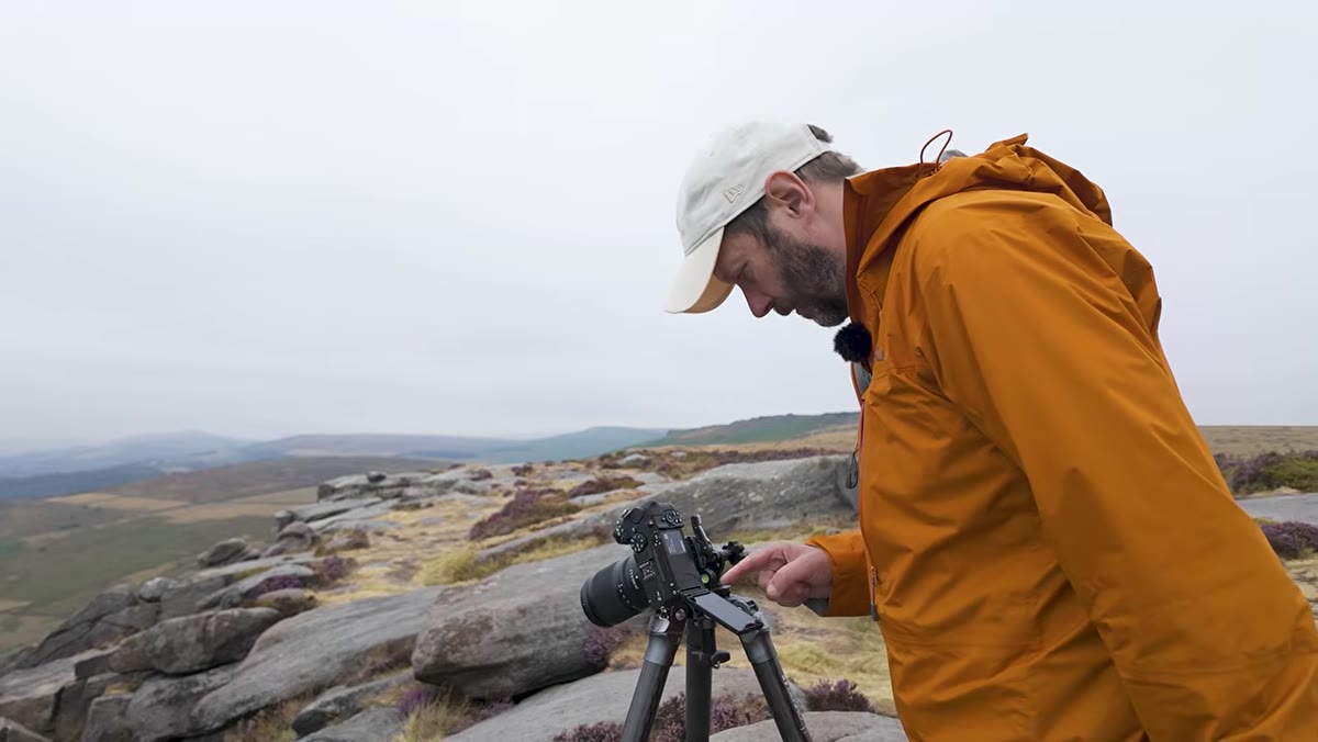 Danson setting aperture to F11 before focusing