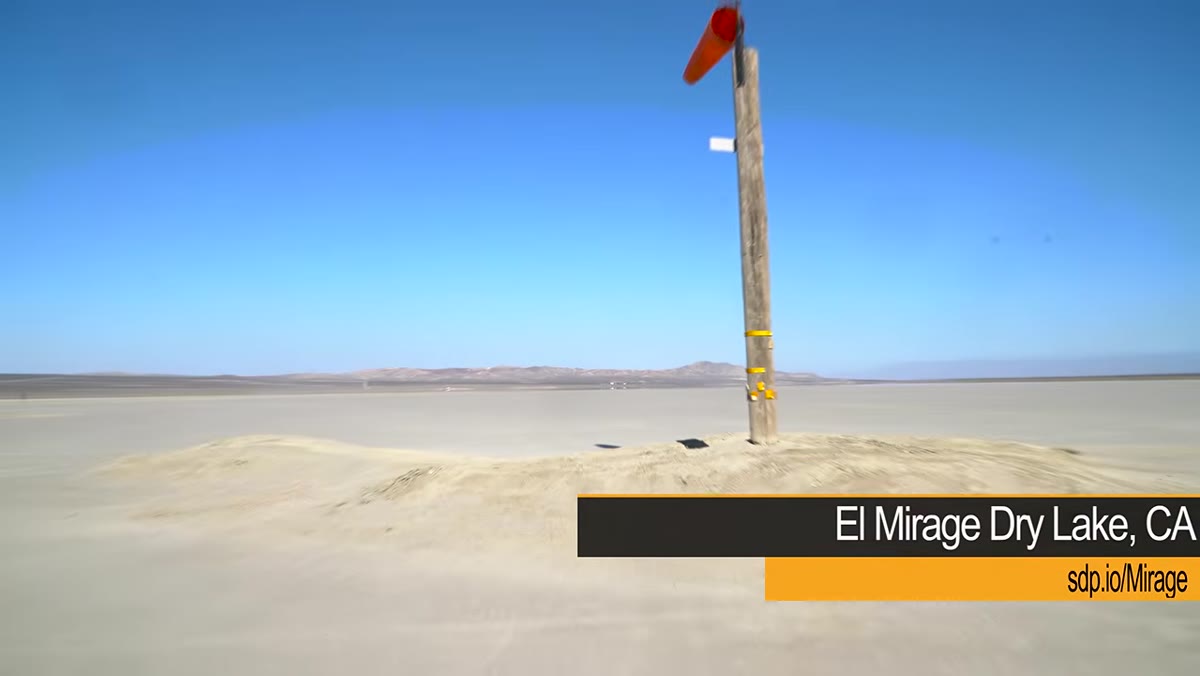 K-1 tracking RC car across dry lake bed, focus points clustered in center