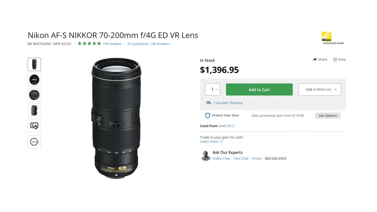 Lambert holding both lens versions side by side for comparison
