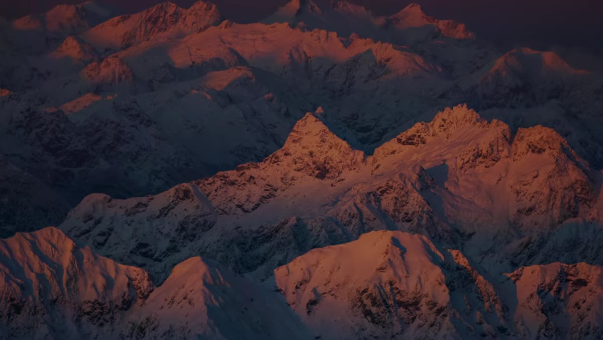 Side-lit snow on mountain ridgeline showing texture