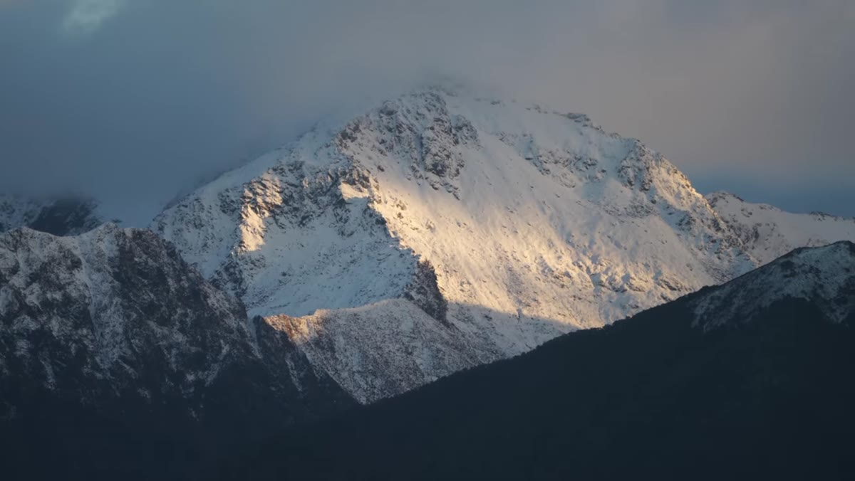 Tight crop on mountain face showing shadow-defined ridgelines
