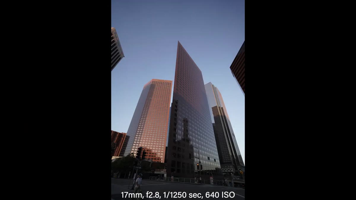 JP reviewing building shots and noting vignette behavior at f/2.8 vs f/4