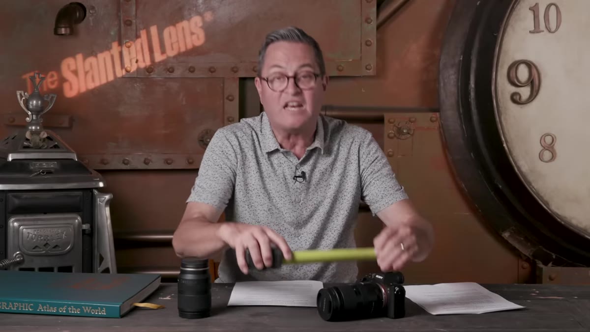 Host holding up lens to demonstrate 5.25-inch length