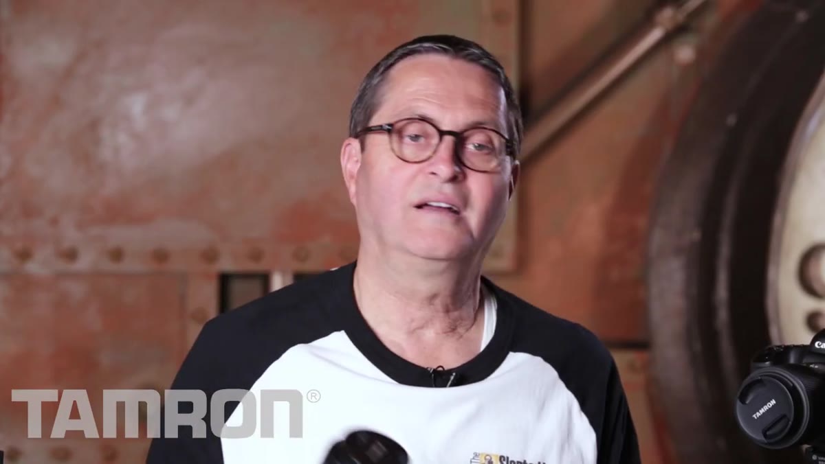 JP holding both lenses up side by side