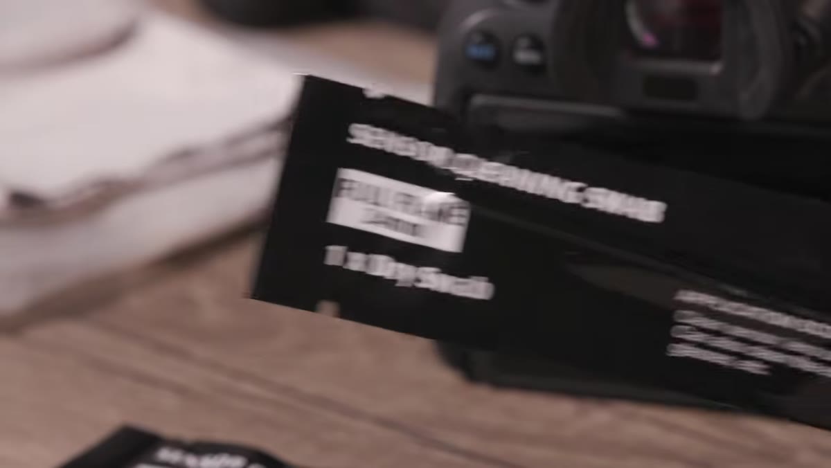 Lens pen being applied to front element of a lens