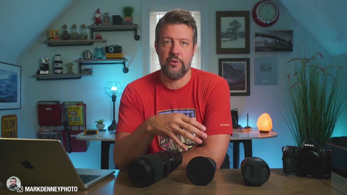 Mark explaining his previous two-lens setup at a trailhead