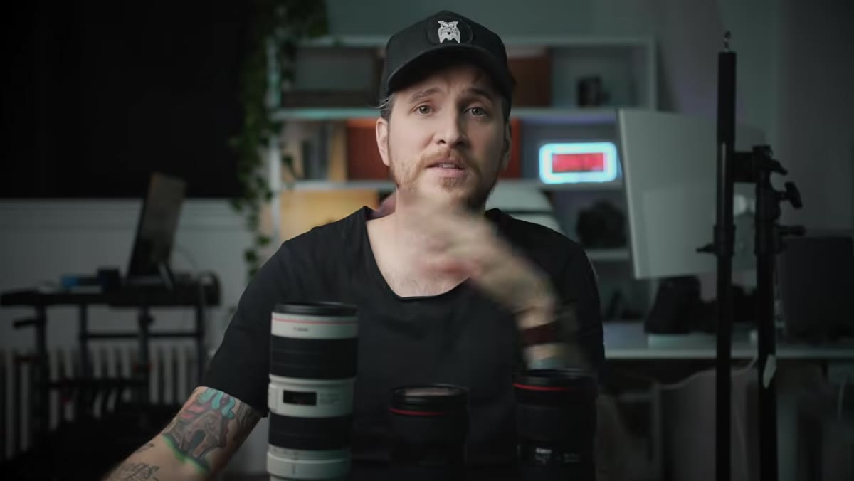 McKinnon holding the 16-35mm lens while discussing vlogging and wide shooting