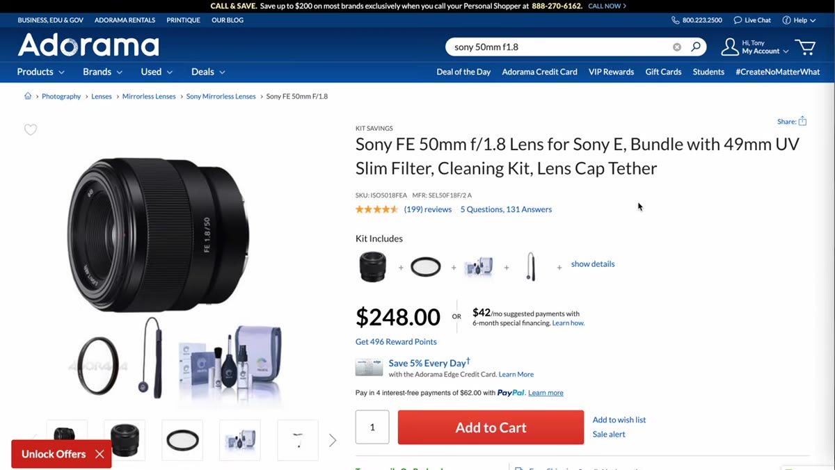 Tony holding the Sony 50mm f/1.8 next to the Sigma for comparison