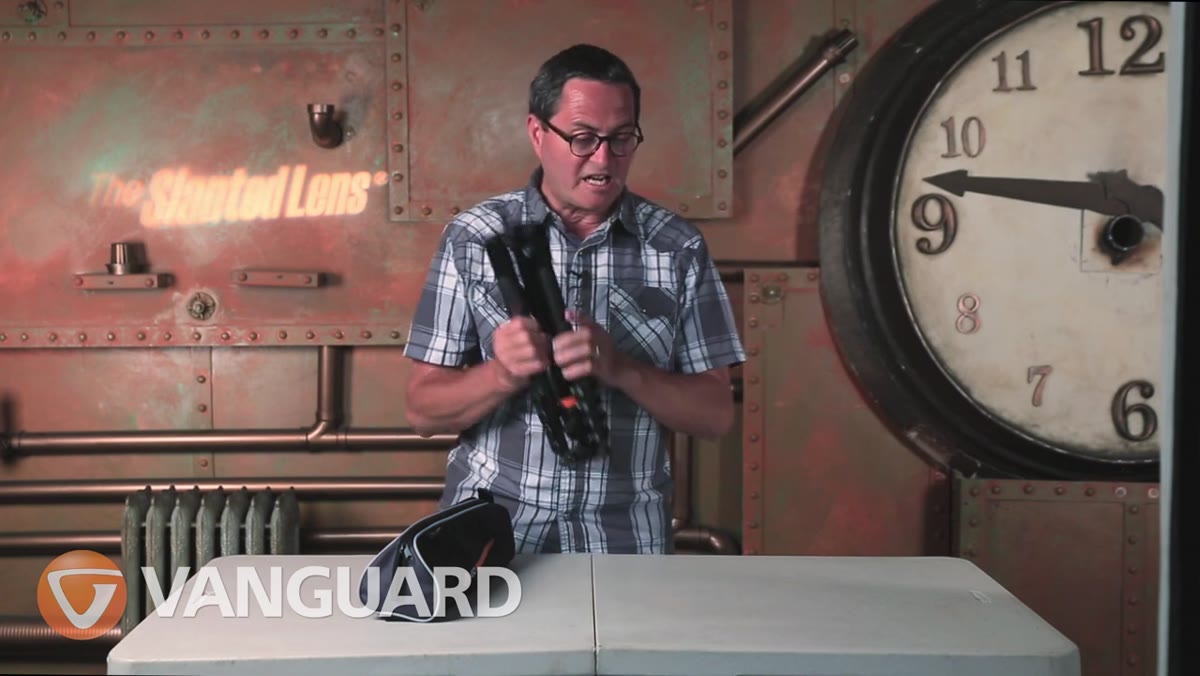 Tripod sliding into side pocket of VEO backpack