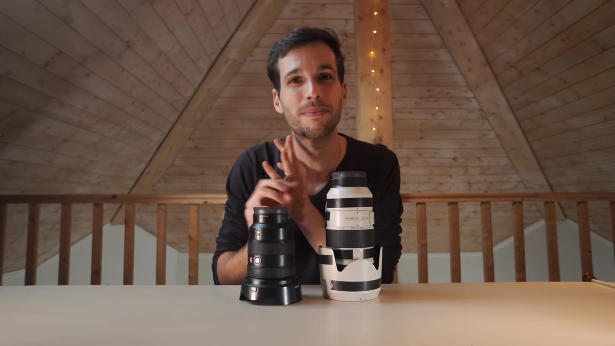 Pierre holds up the 16-35mm and 70-200mm side by side