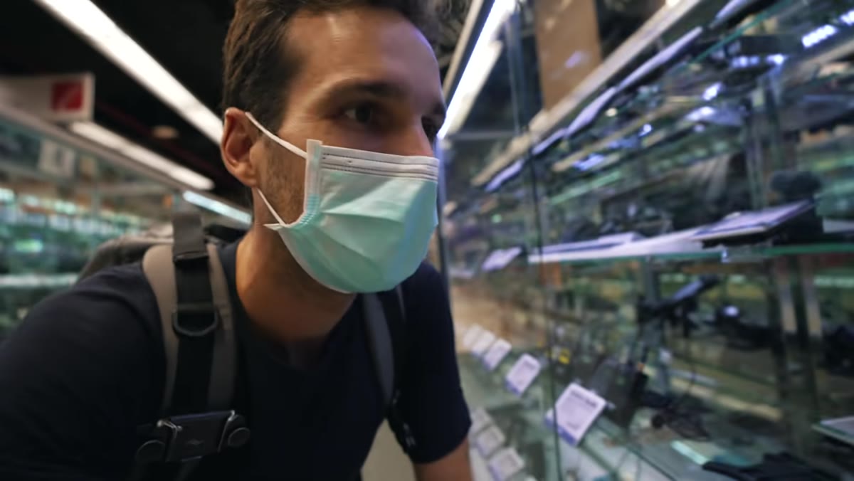 Hands-on with a microphone or small accessory at the counter