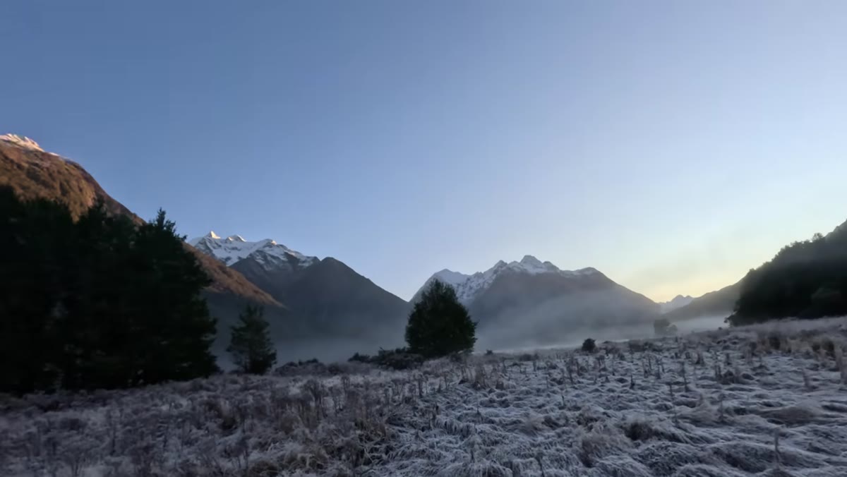 William walking several hundred meters to realign distant tree and mountain