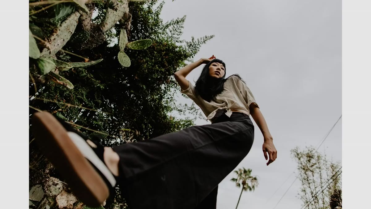 Photographer adjusting shooting angle relative to subject